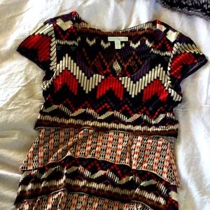 Colorful patterned short sleeved blouse.